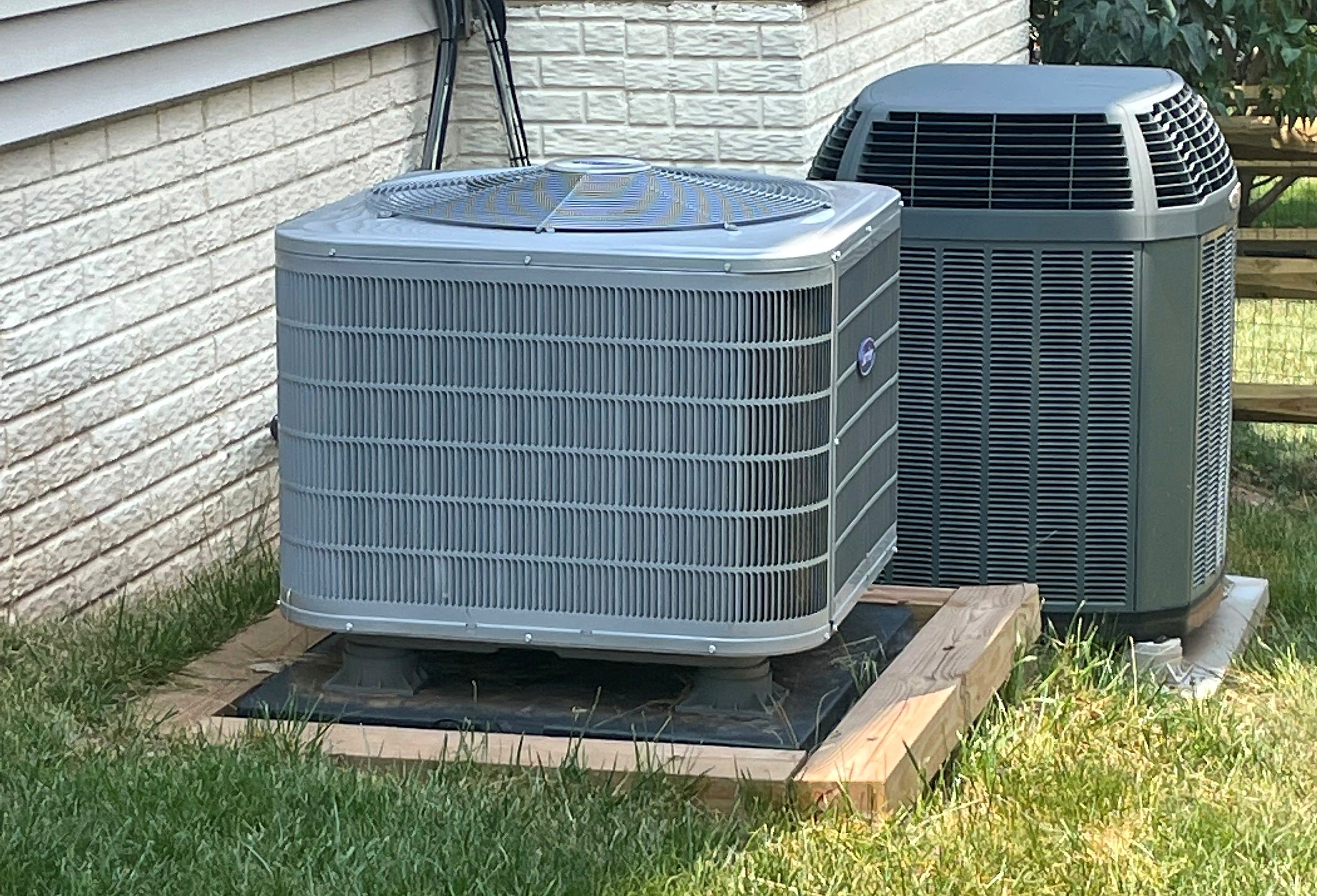 Two newly installed outdoor air conditioning units at a Northern Virginia home